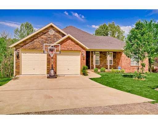 Exterior Front. Beautiful front exterior with rock, brick.  Room to sit and relax on the front porch!