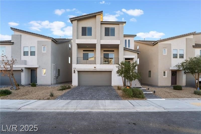 View of front facade featuring stucco siding, an a