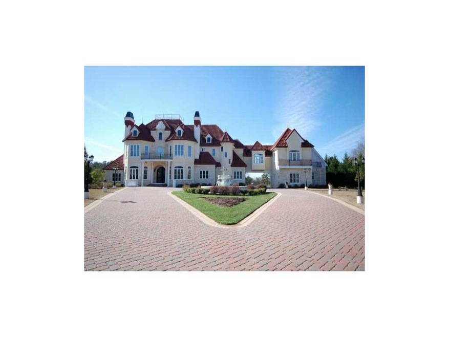 Exterior Front. Gated Mediterranean estate.