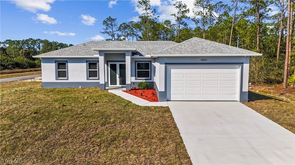 Ranch-style house with a garage and a front yard