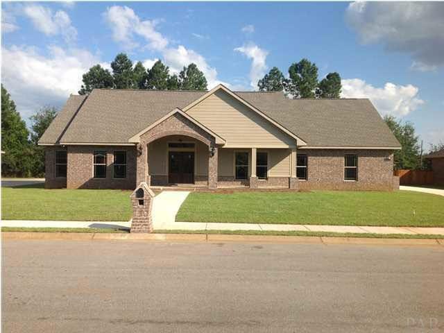 Front of home with sidewalk and brick mailbox