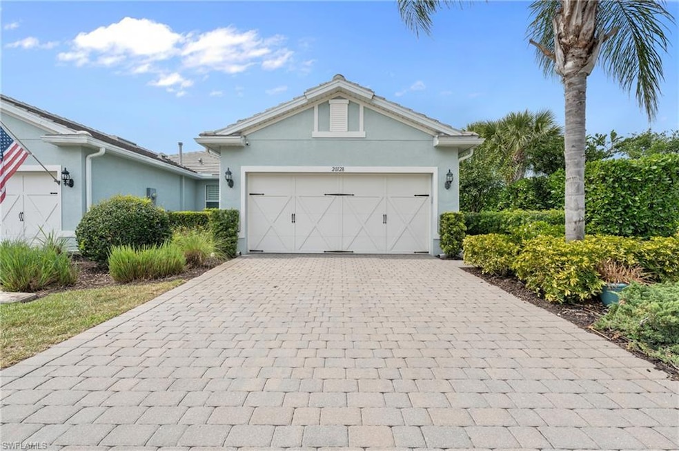 View of front facade featuring a garage, decorativ