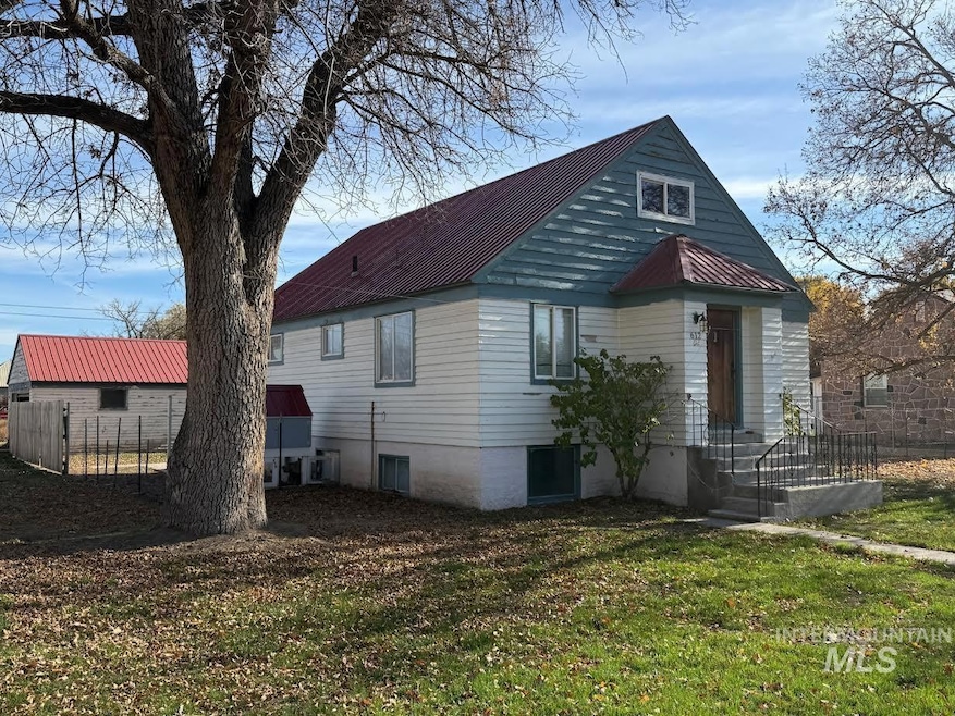 View of front of house with a metal roof