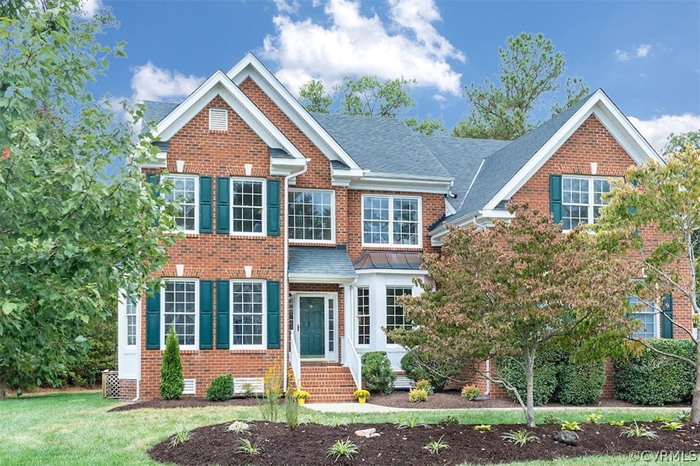 Brick front and beautifully landscaped yard.