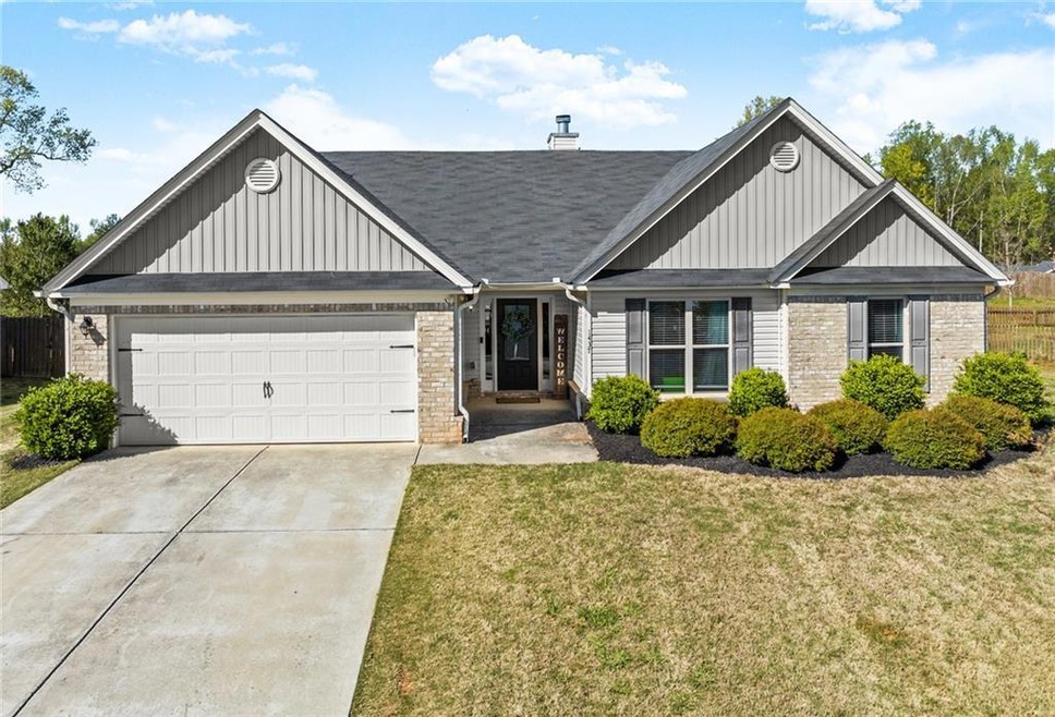 View of front of property with a front yard and a 