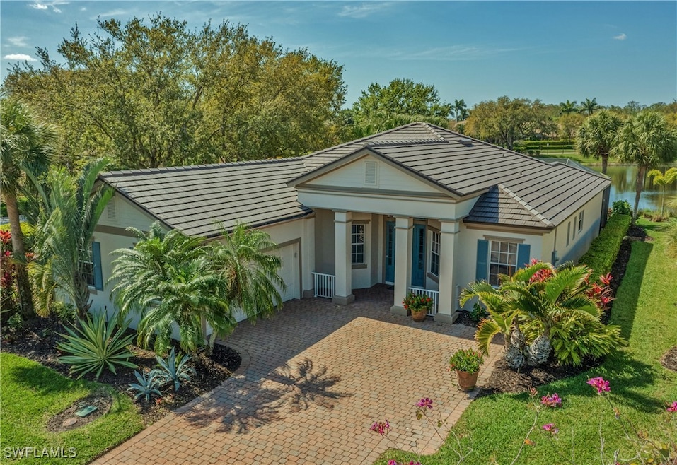 View of front of house featuring decorative drivew