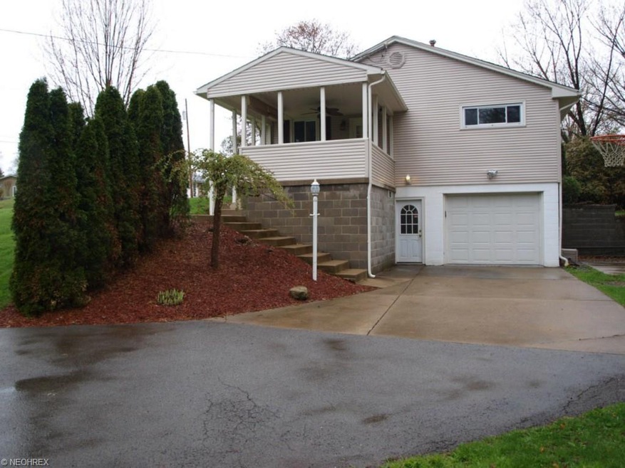 Driveway to garage & land scape