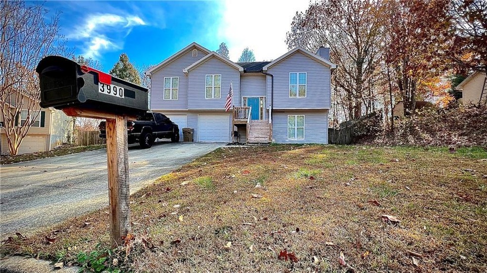 Bi-level home featuring a garage