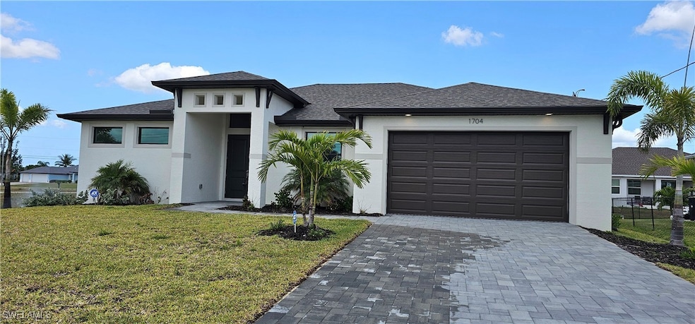 Prairie-style house featuring stucco siding, decor