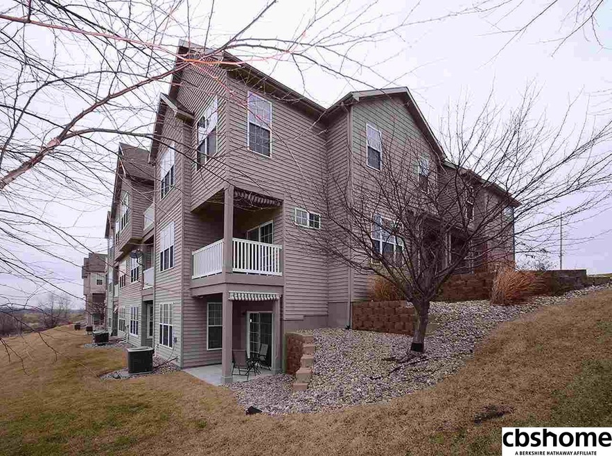 Rear deck, and patio from walk out basement.  Overlooks Tregaron Golf Course