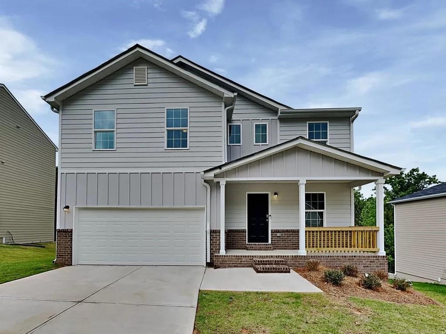 Craftsman-style house featuring a garage and a porch