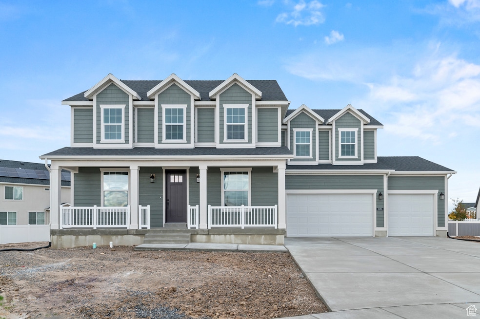 View of front of home featuring concrete driveway, a porch, an attached garage, and a shingled roof