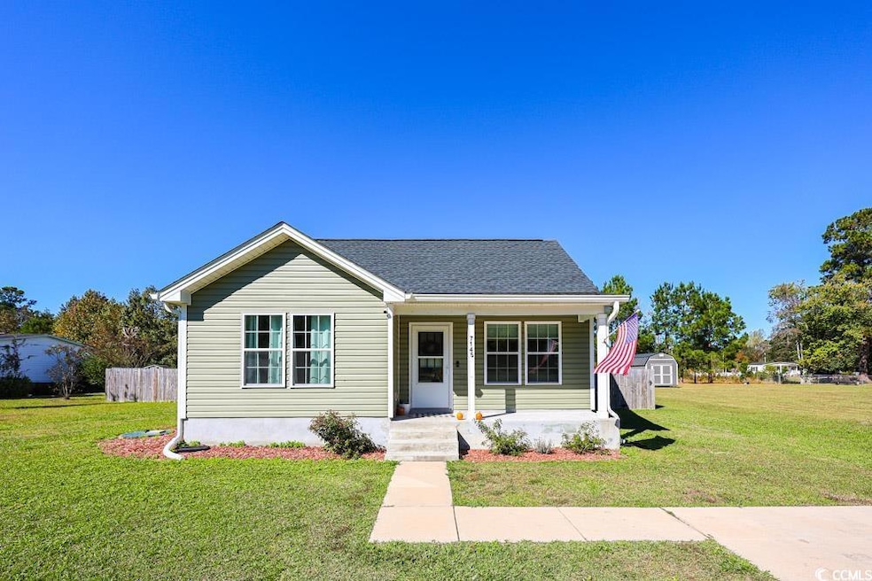 View of front facade with a porch and a shingled roof