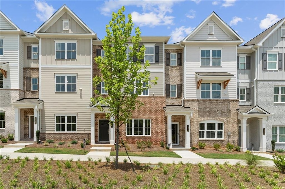 Craftsman-style home featuring board and batten siding and brick siding