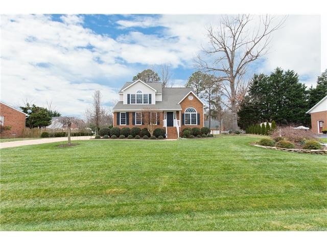 Custom built partial brick home on lovely lot.