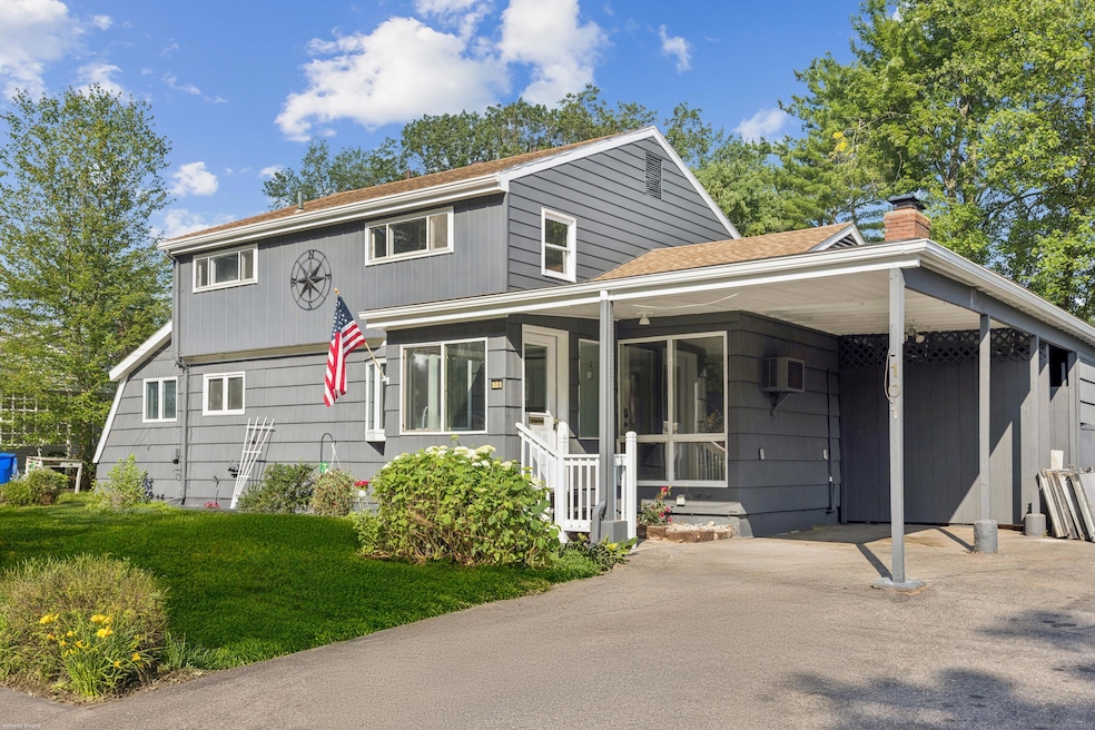 East Hartford Colonial home with mature landscaping near Glastonbury CT townline