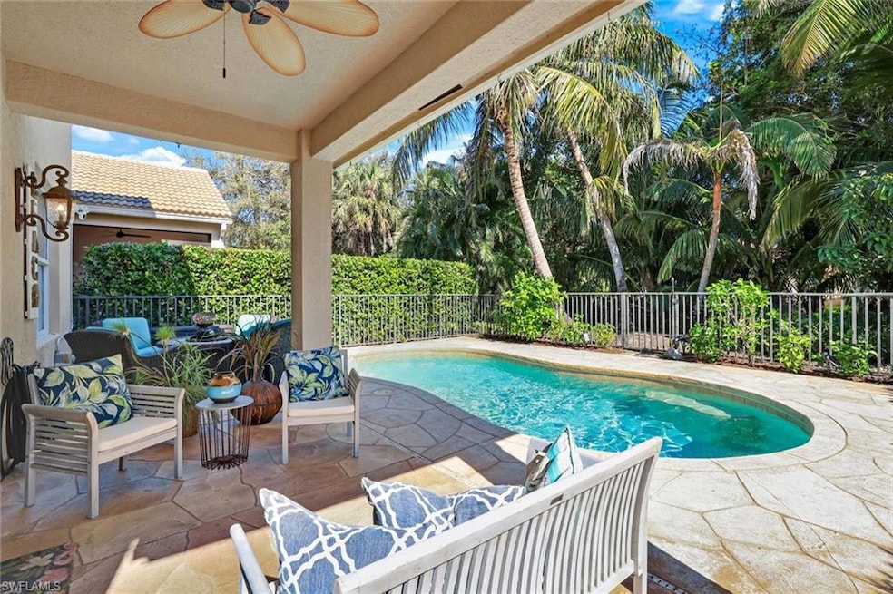 heated pool with fenced in pool deck