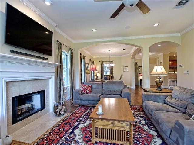 Living Room with arched architectural details is o