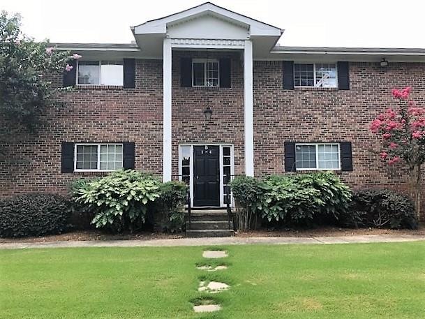 4 side brick building with lovely well maintained 