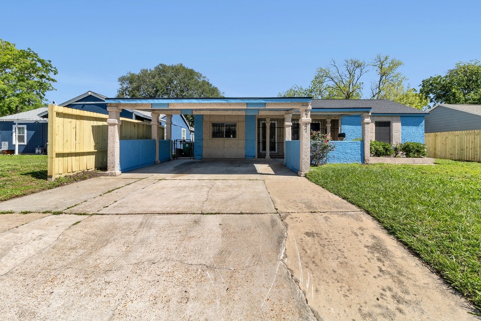 Front view of a single-story house with blue stucc