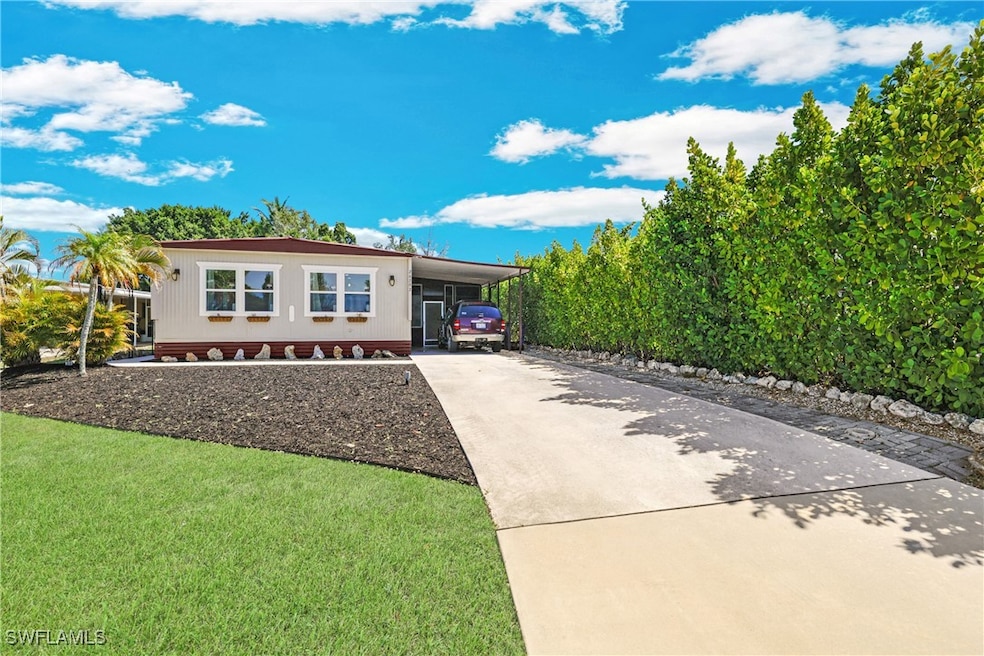 View of front of home with concrete driveway, an a