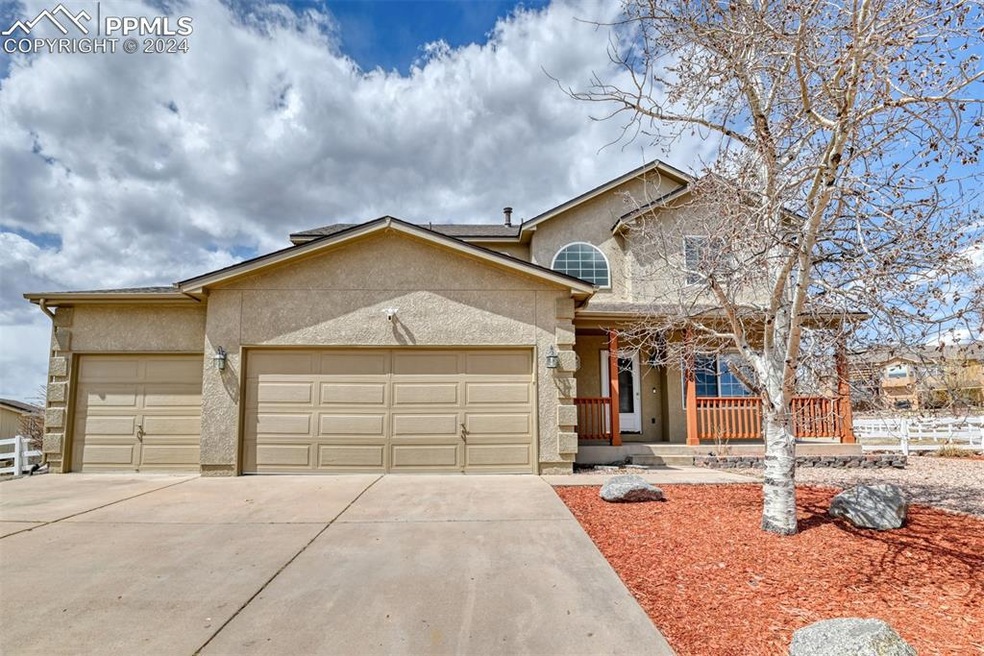 View of front of property with a garage