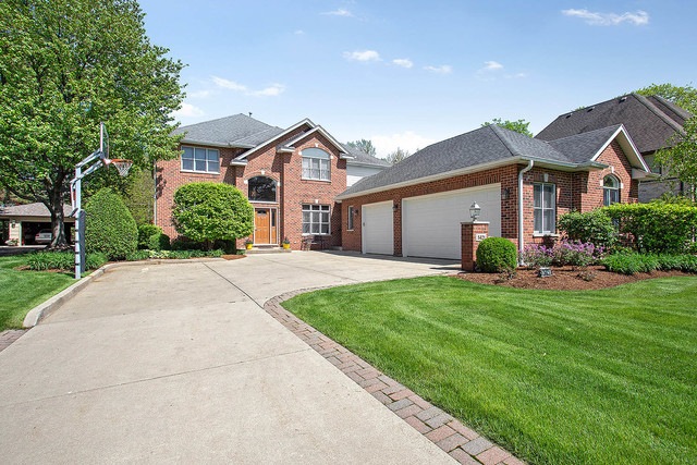 All brick home with attached three car garage on p