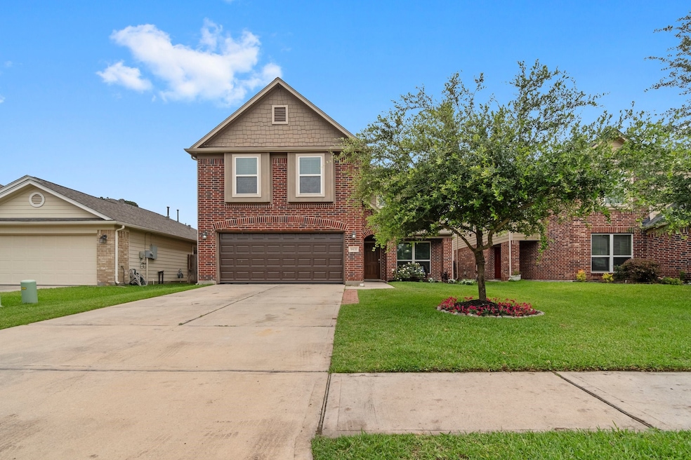 This is a two-story brick home with a gabled roof