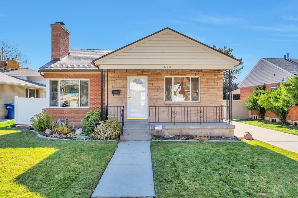 Bungalow featuring stone siding, a porch, a chimney, and brick siding