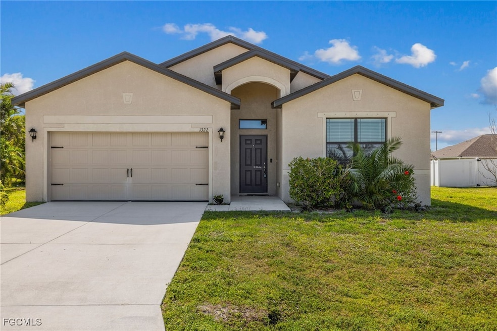 Single story home featuring stucco siding, a garag