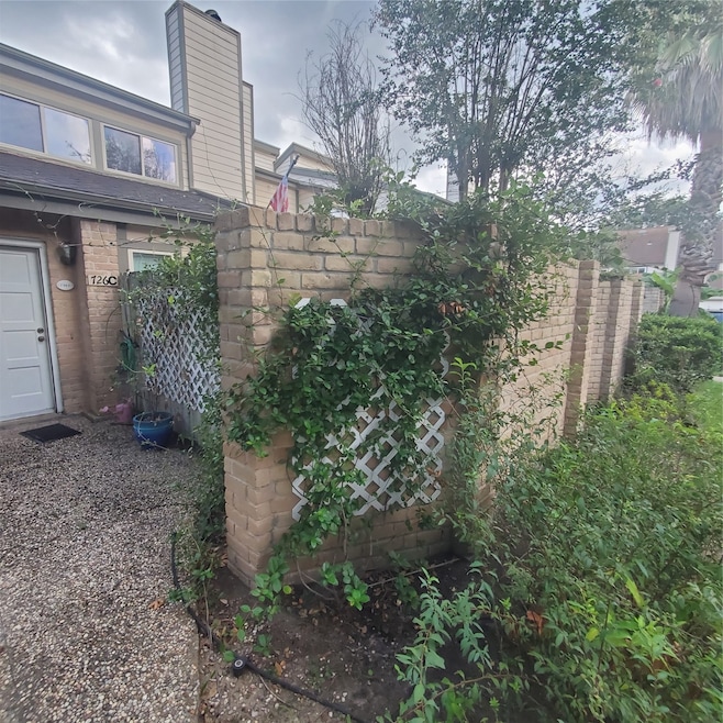 Front Entrance at privacy brick wall