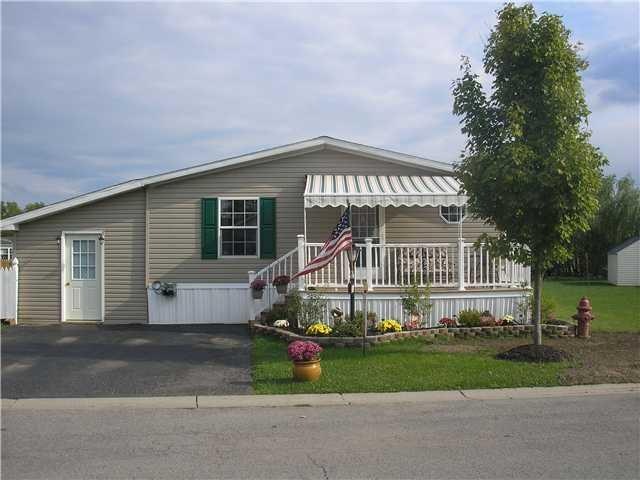 Exterior Front. Enjoy relaxing under the awning. F