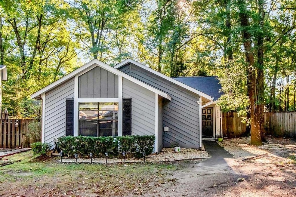 View of front of property with a shingled roof