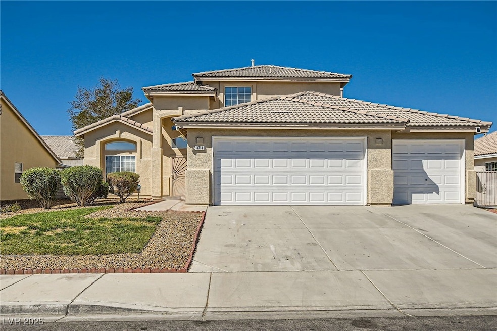 View of front of property featuring a tiled roof,