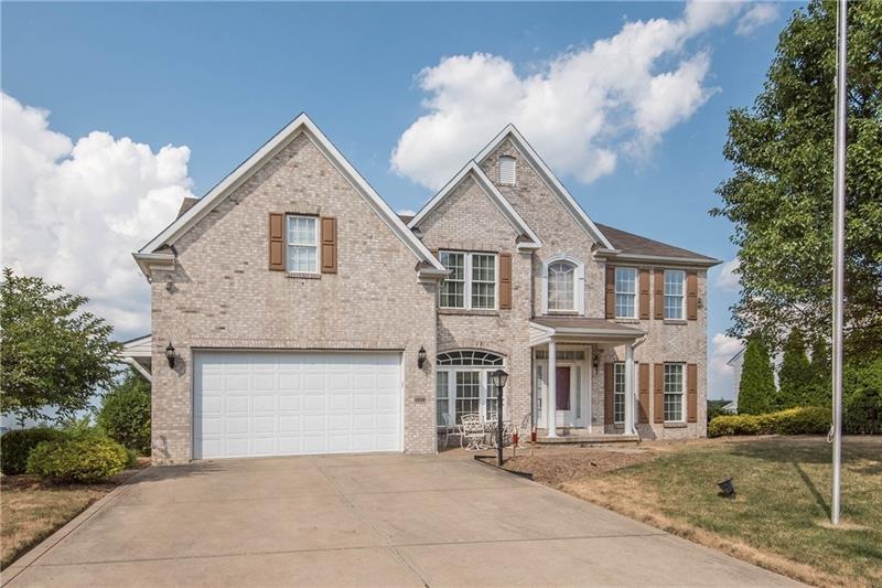 Welcome home to this stunning brick-front home at 