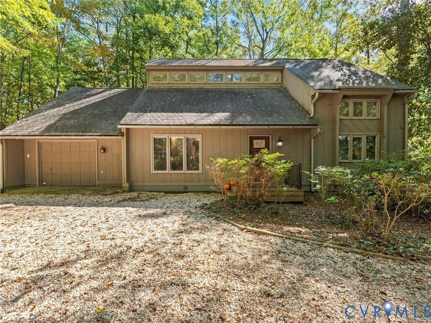 Back of house with roof with shingles