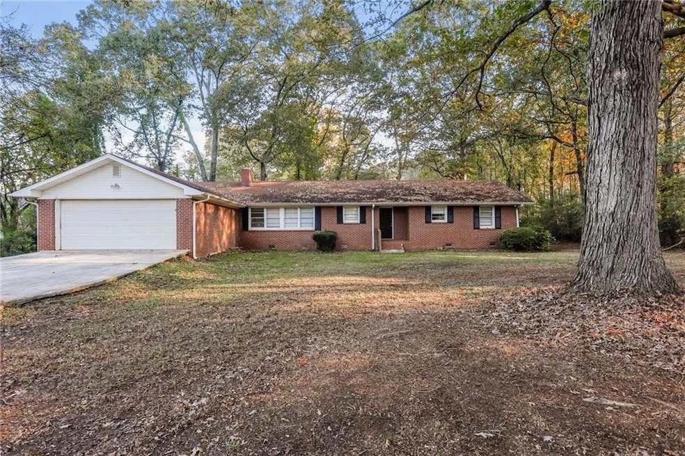 Ranch-style home with a garage