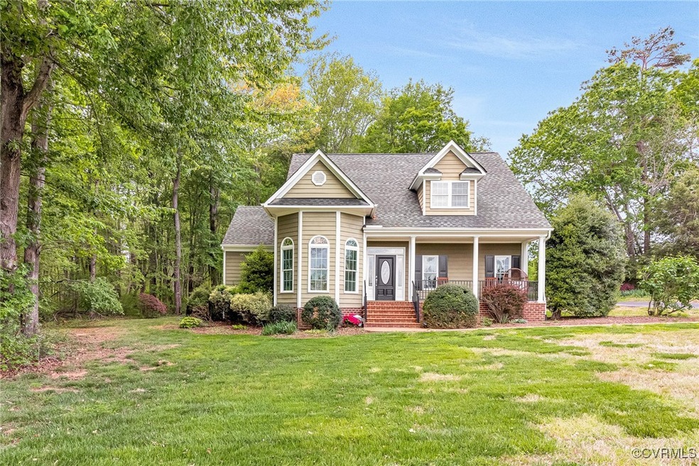 View of front of property featuring a shingled roo
