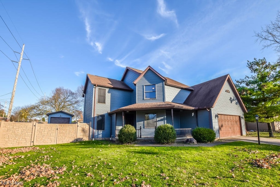 View of front facade with a front yard and a porch