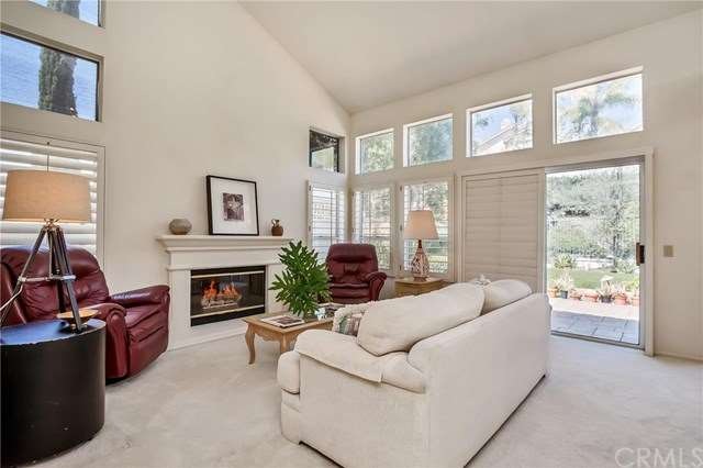 Delightful family room features high vaulted ceili