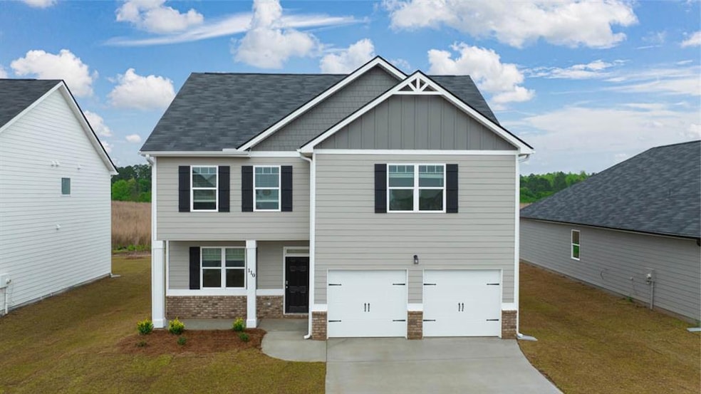View of front of home featuring a garage and a fro