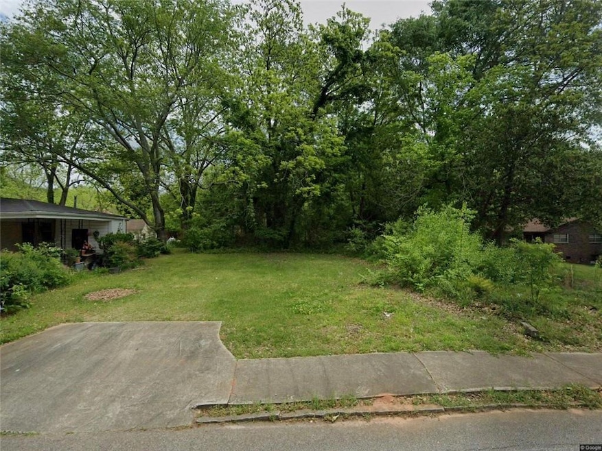 View of yard featuring view of wooded area