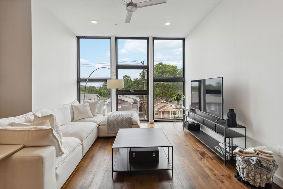 Living area featuring a wall of windows, a ceilin