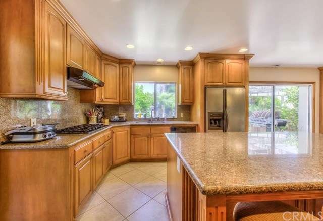 The beautifully designed gourmet kitchen has a 5 b