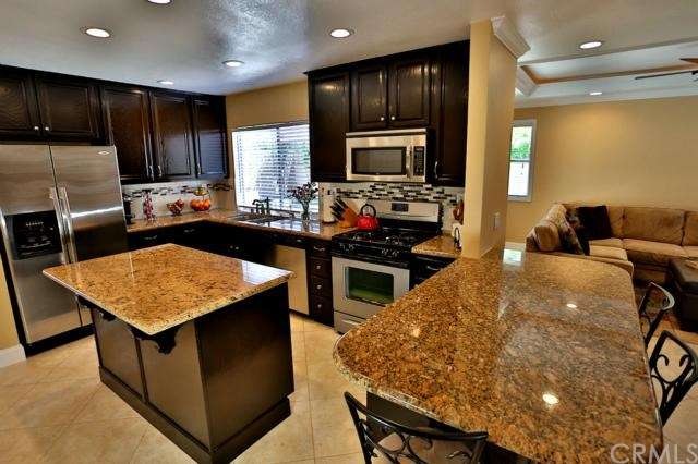 Updated kitchen with granite counter, Island and Breakfast bar