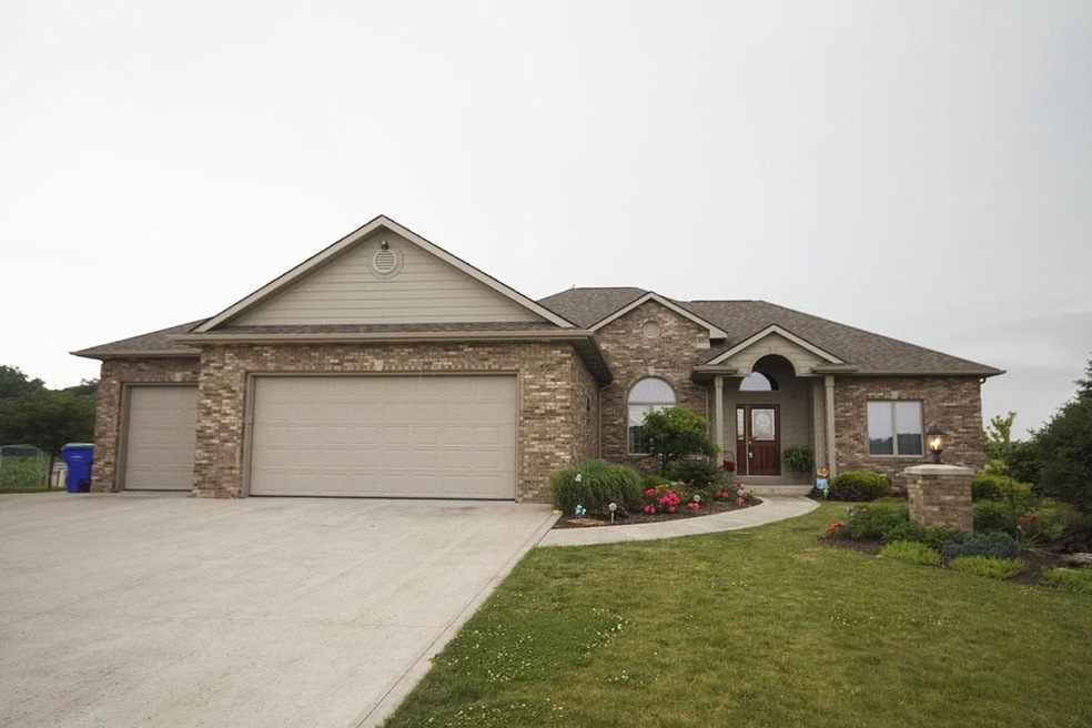 Located on 3 acres with a 3 car garage plus a deta