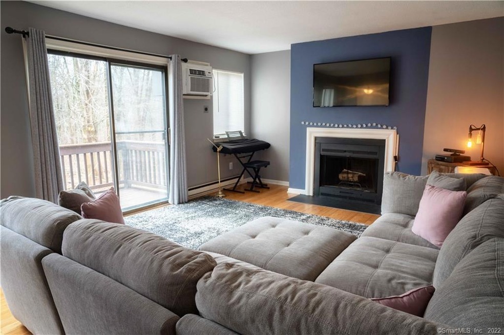 Living Room with bamboo flooring, sliders to outdo