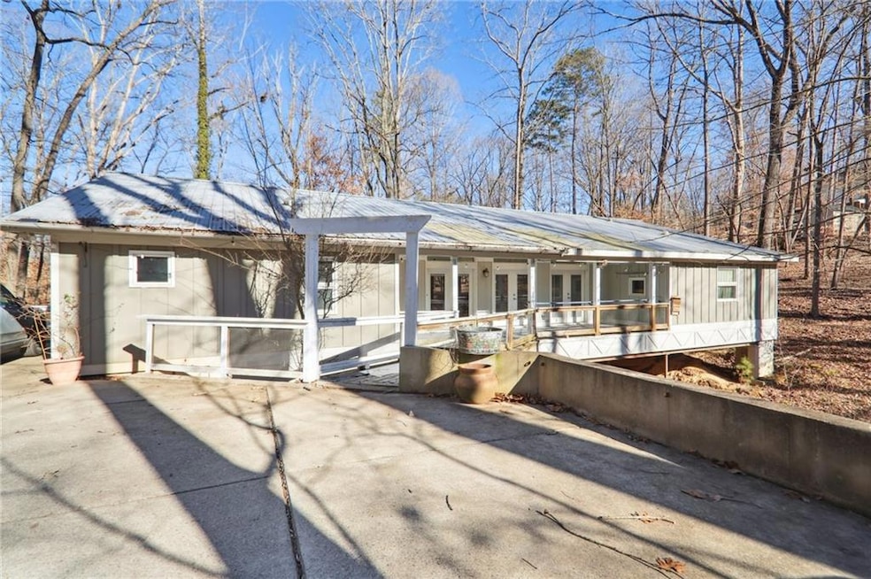 View of front of home featuring french doors and a metal roof