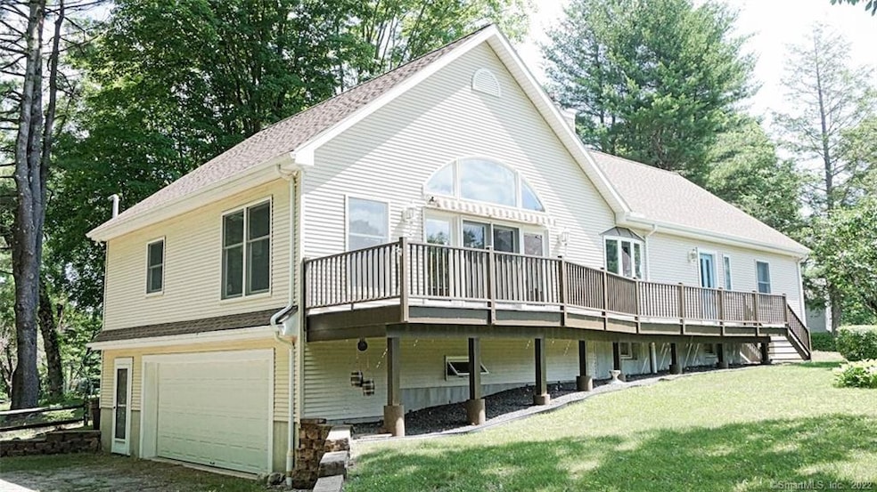 Side and front view shows 2 car garage, lower leve