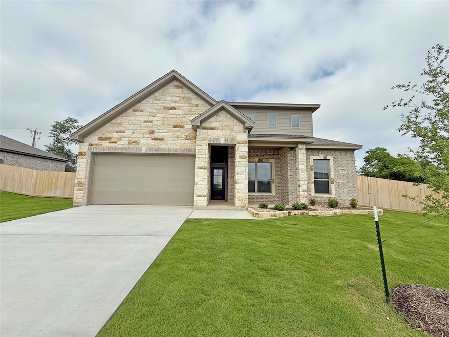 French provincial home featuring a front lawn, dri